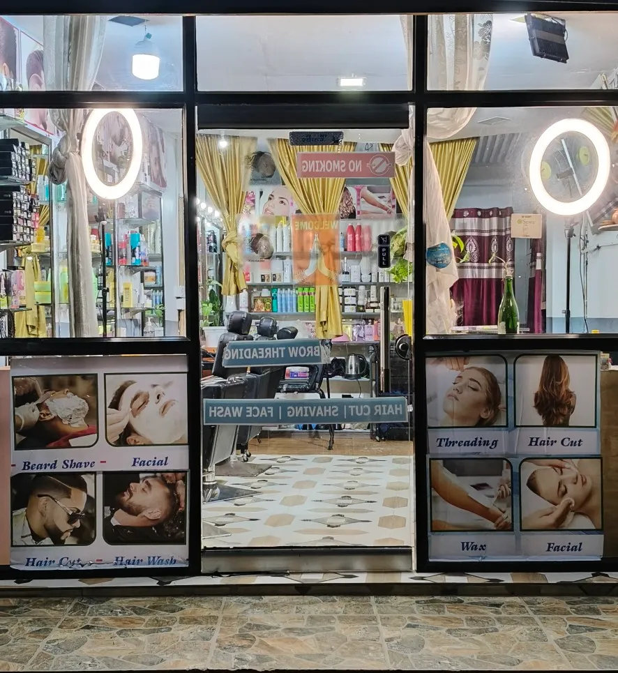 Glass entry doors with service display posters under ring lights