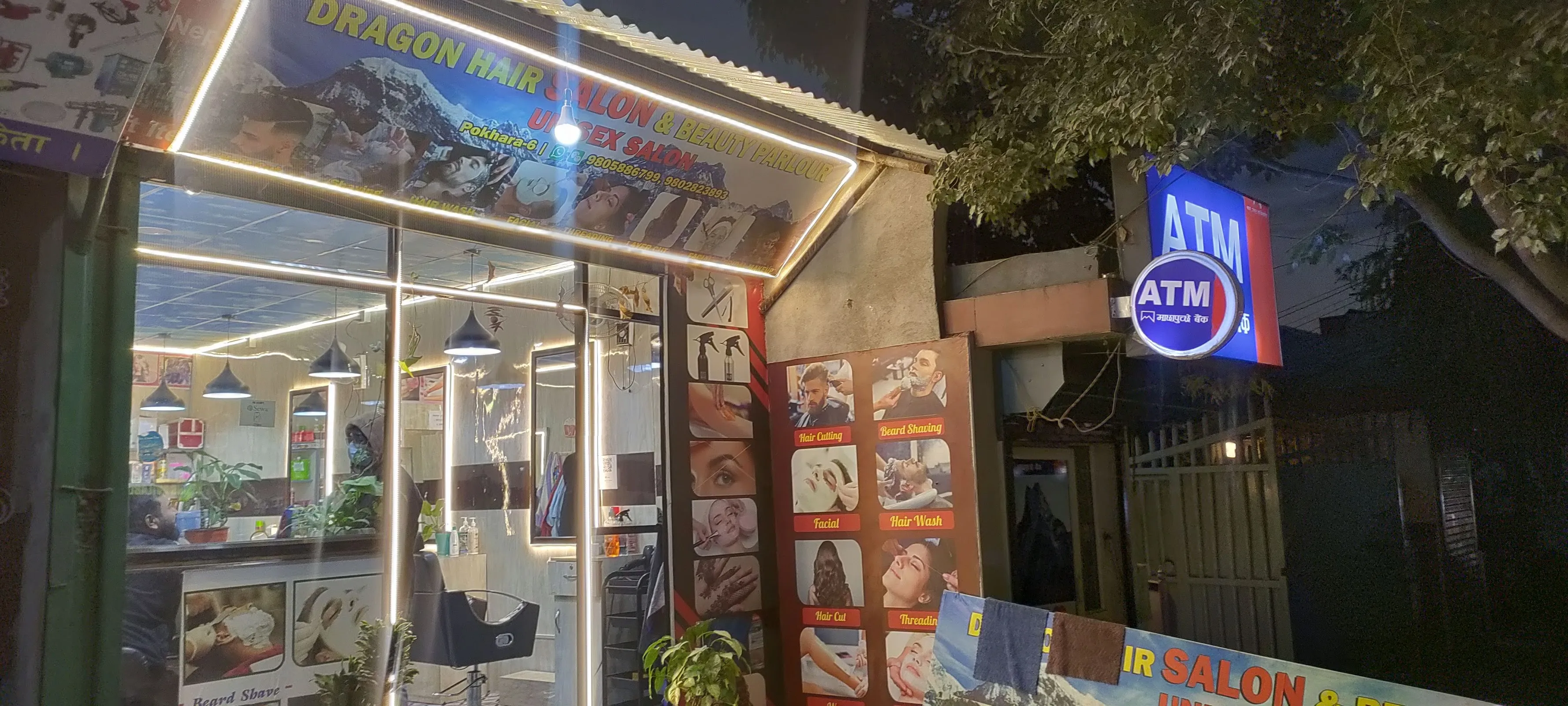 Dragon Hair Salon & Beauty Parlour storefront glowing at night in Lakeside Pokhara